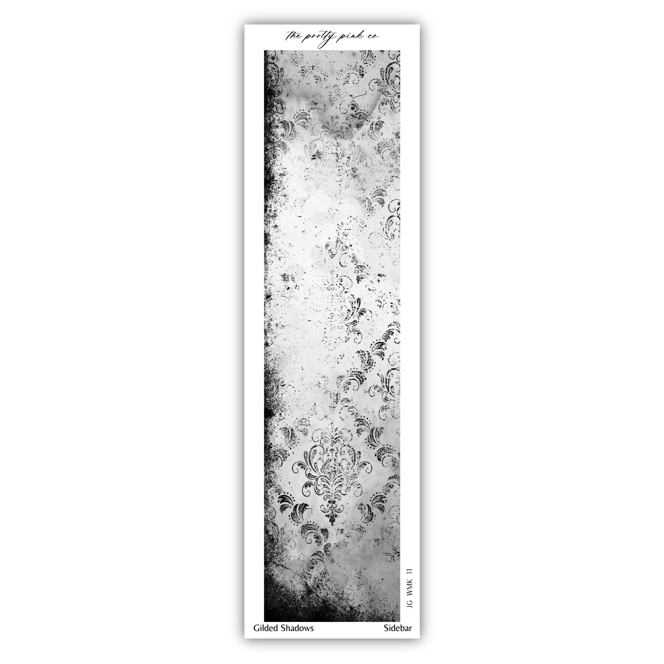 The image is a black and white photograph of a wall with a repeating pattern of floral designs.