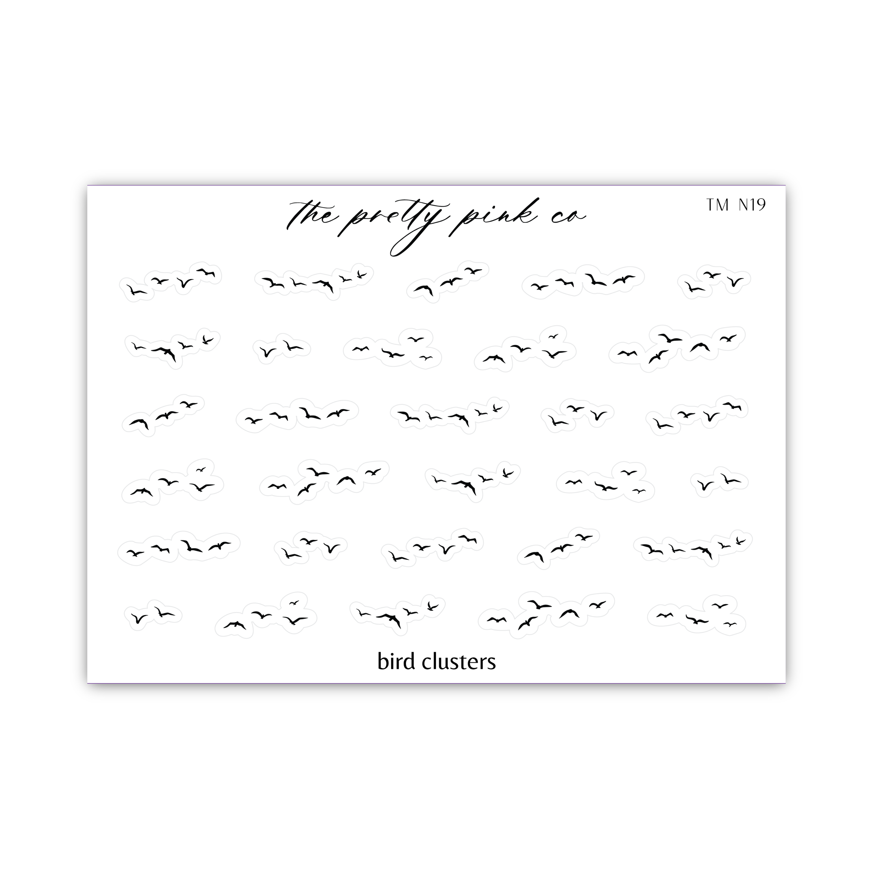 a piece of paper with birds flying in the sky