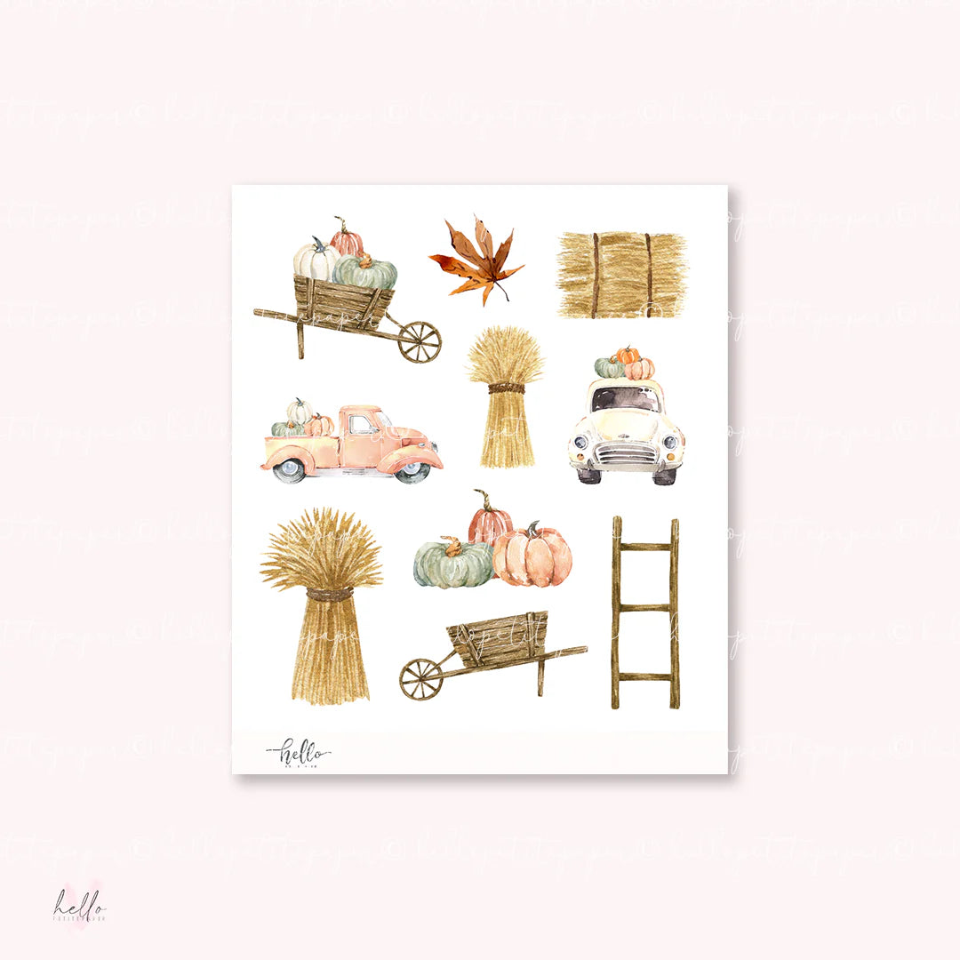 The image is a collage of various autumn-themed objects, including a wagon, a ladder, a basket of pumpkins, a leaf, and a straw bale.